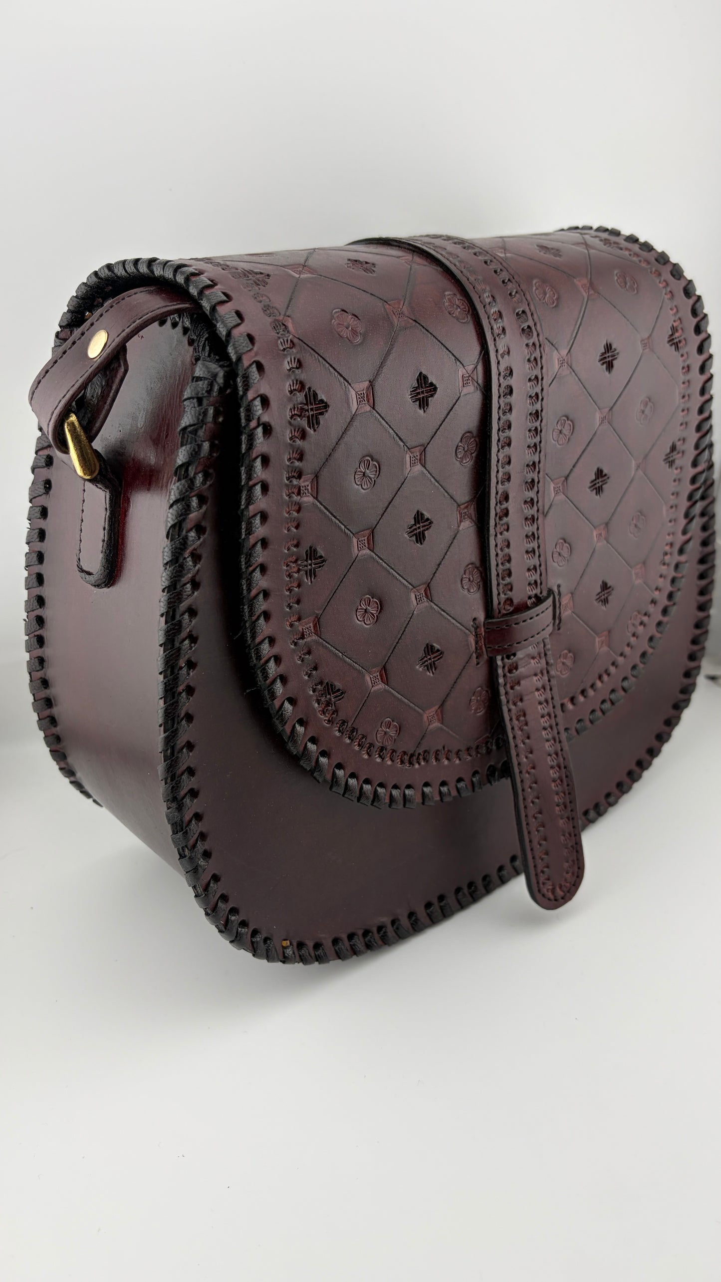 ZYGMA Handmade Genuine Leather Round Saddle Crossbody Bag | deep brown | Diamond Clover Embossed Flap | Whipstitch Edge | Top Handle + Crossbody Strap