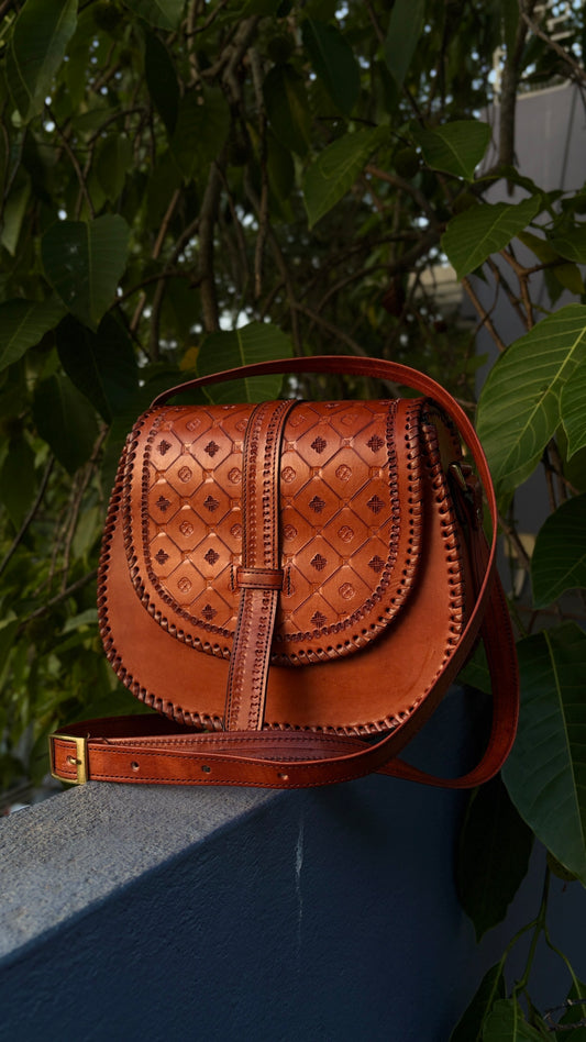 ZYGMA Handmade Genuine Leather Round Saddle Crossbody Bag | Cognac Tan | Diamond Clover Embossed Flap | Whipstitch Edge | Top Handle + Crossbody Strap
