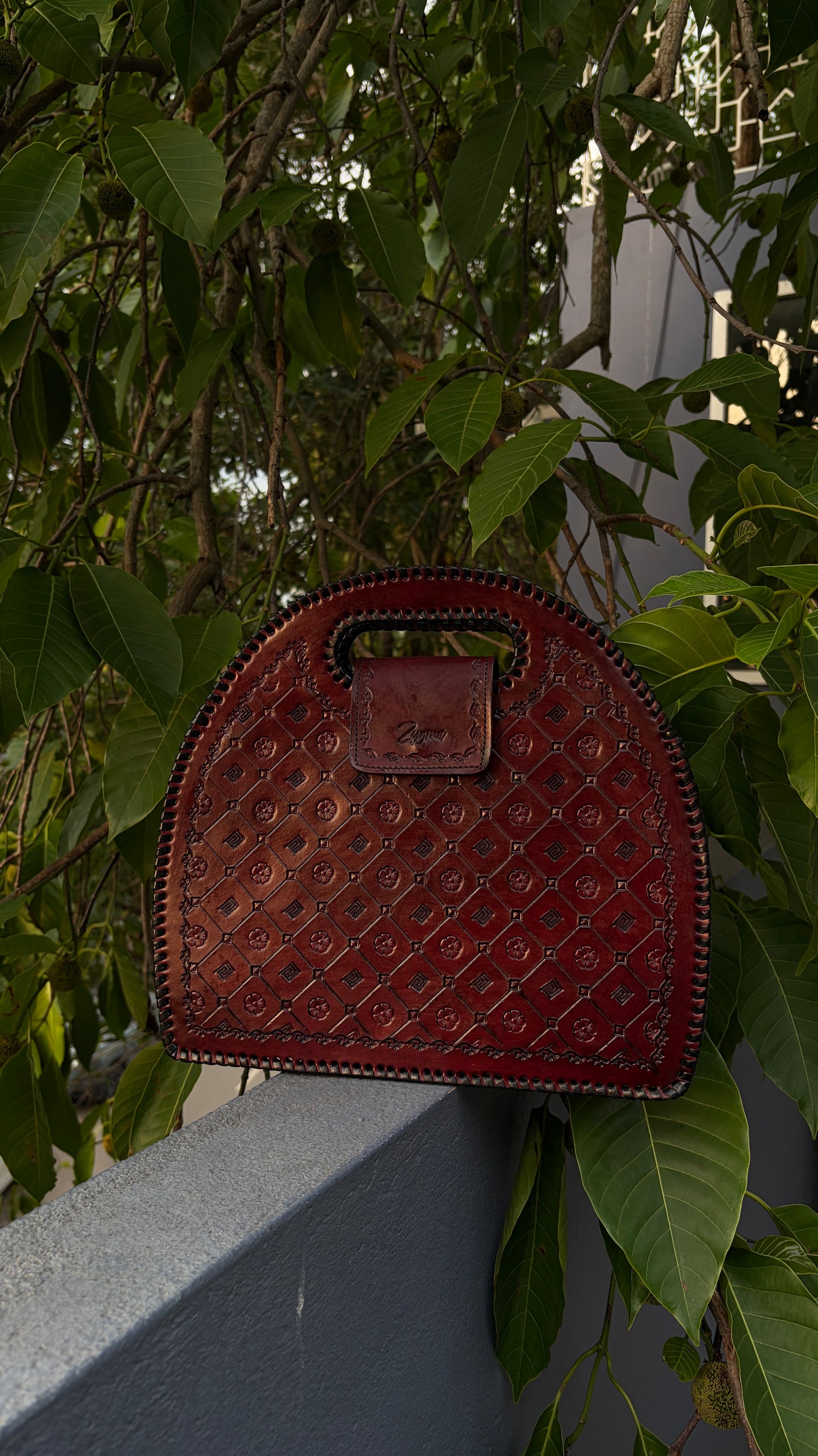 Zygma Embossed Dome Handbag — Genuine Leather