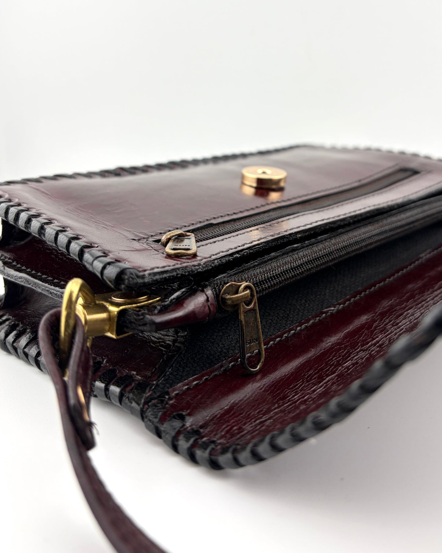 Zygma Handmade Genuine Leather Sling Bag for Women | Hand-Stamped Clover Diamond | Burgundy Wine | Compact Crossbody Bag | Black Whipstitch | Gold Brass Buckle Strap | Artisan Ethnic Boho Purse | Made in India