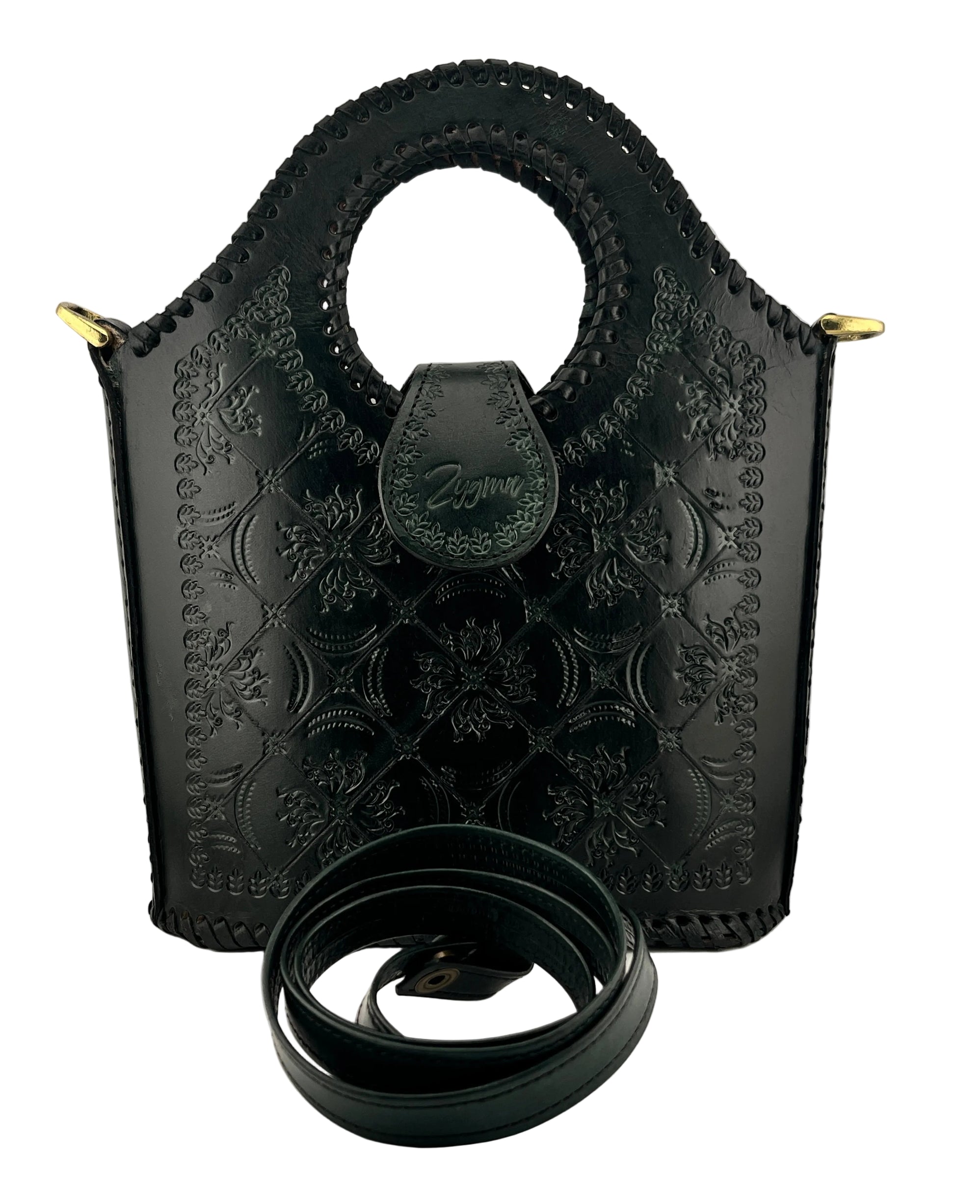 green leather handbag with intricate patterns and a matching belt on a light gray background