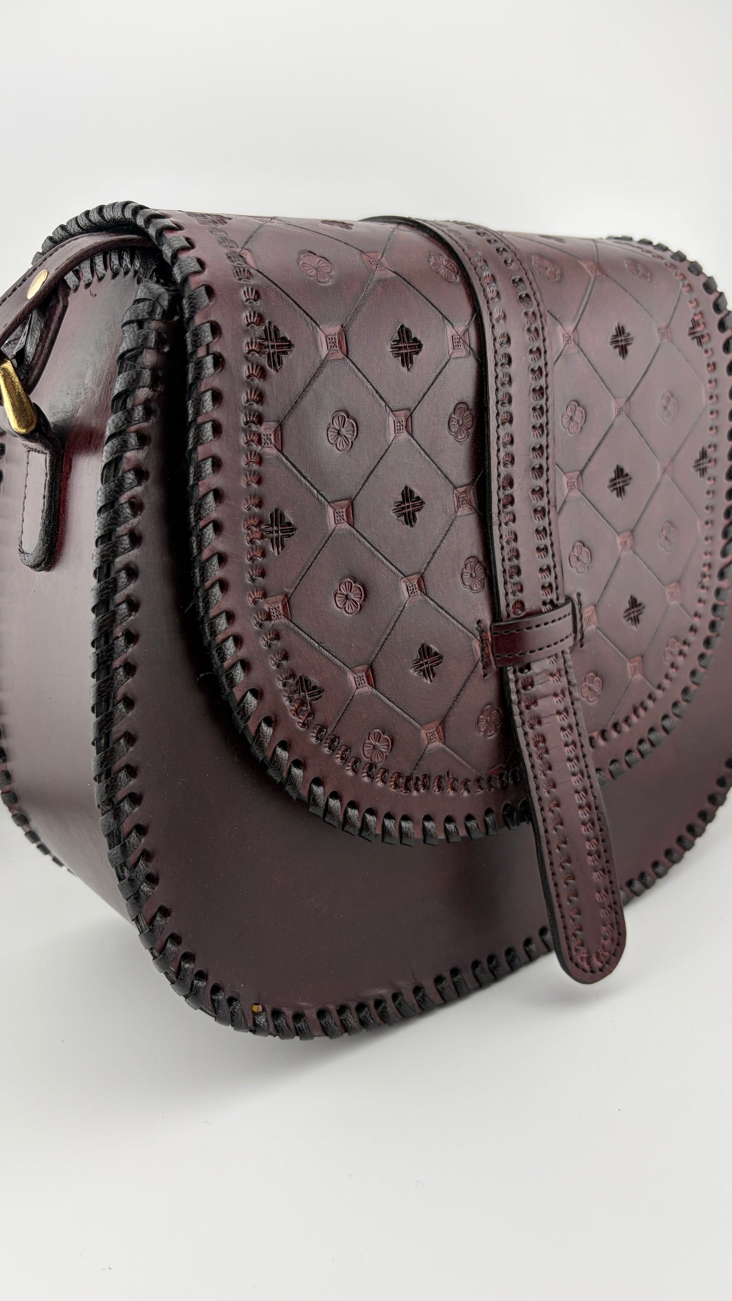 ZYGMA Handmade Genuine Leather Round Saddle Crossbody Bag | deep brown | Diamond Clover Embossed Flap | Whipstitch Edge | Top Handle + Crossbody Strap