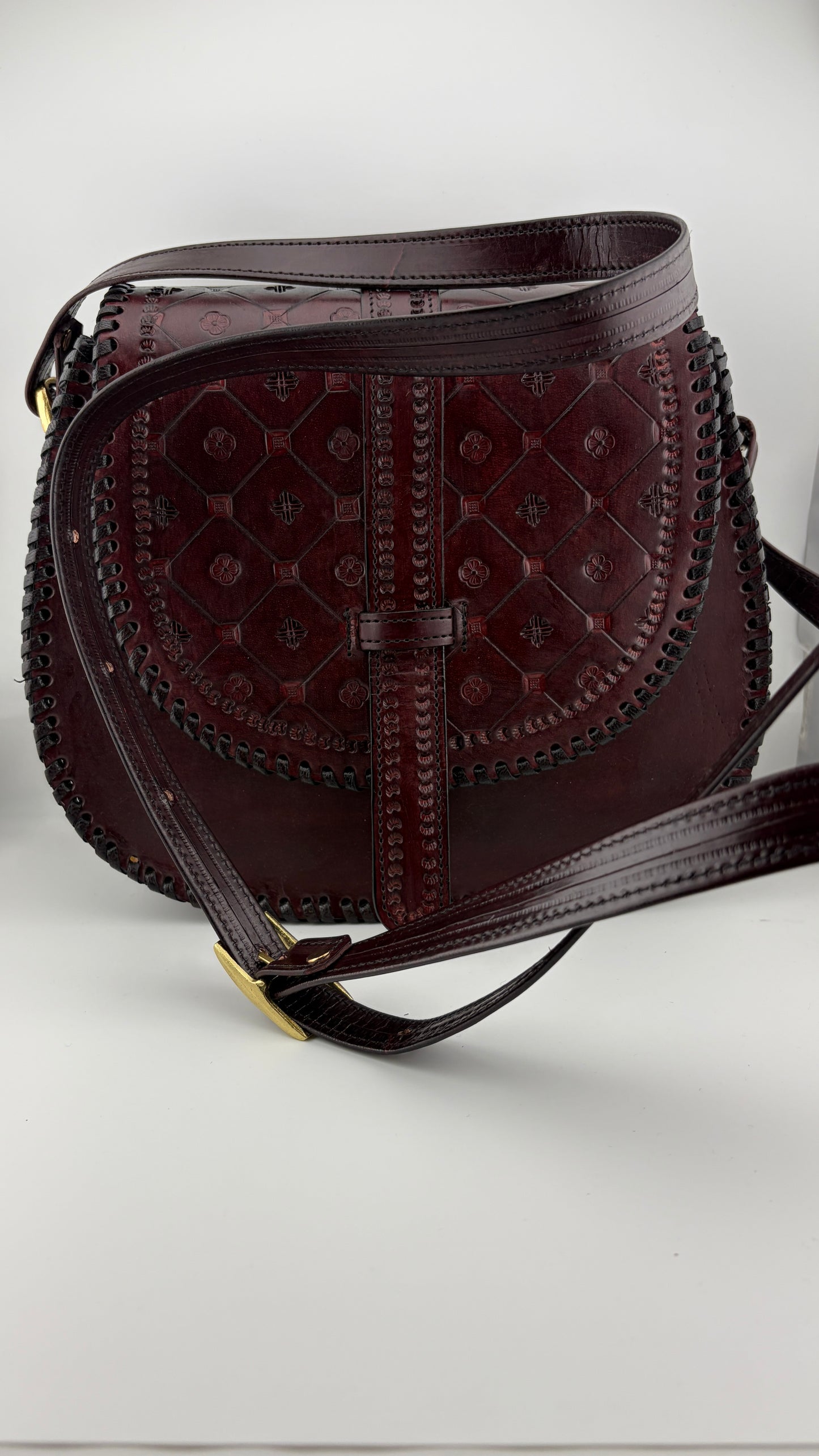 ZYGMA Handmade Genuine Leather Round Saddle Crossbody Bag | deep brown | Diamond Clover Embossed Flap | Whipstitch Edge | Top Handle + Crossbody Strap