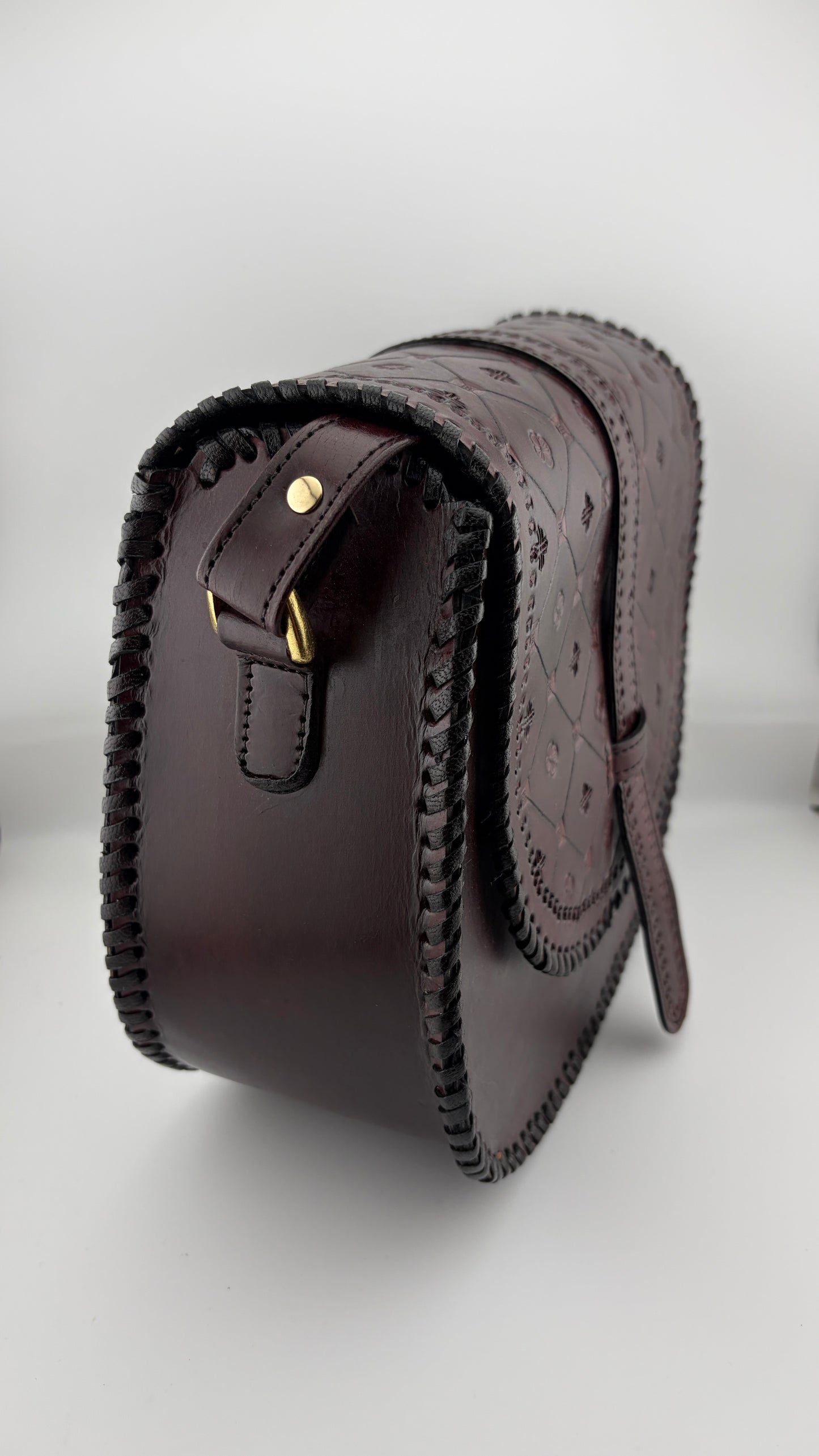 ZYGMA Handmade Genuine Leather Round Saddle Crossbody Bag | deep brown | Diamond Clover Embossed Flap | Whipstitch Edge | Top Handle + Crossbody Strap