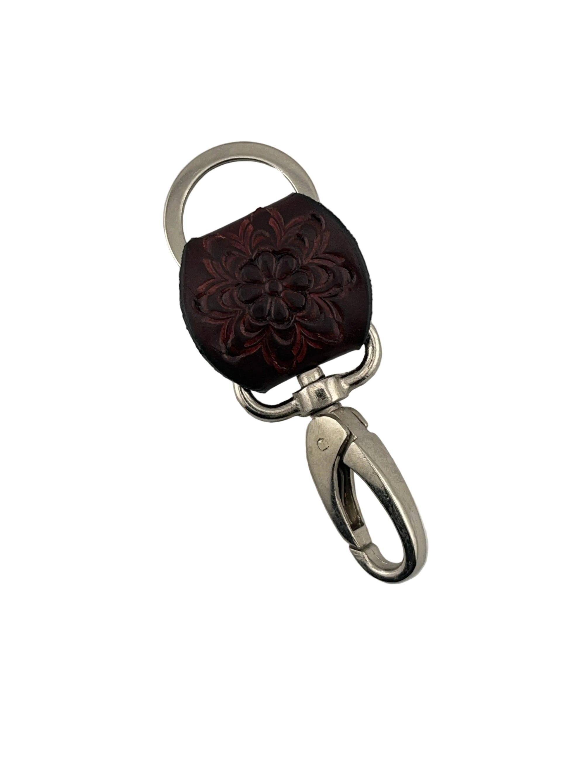 Keychain with floral design on a gray background