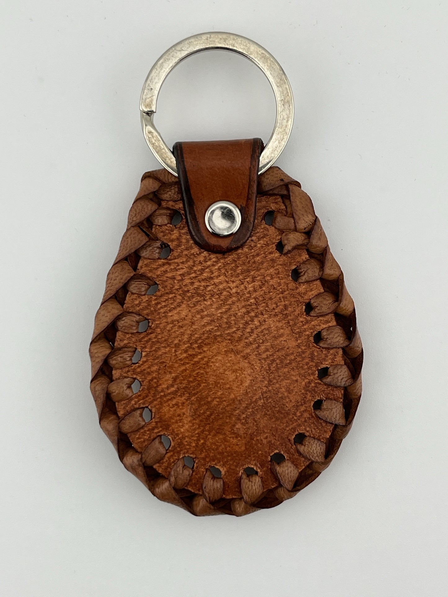 ZYGMA Handcrafted Braided Leather Keychain | Hand-Tooled Floral Embossed Teardrop with Woven Edge