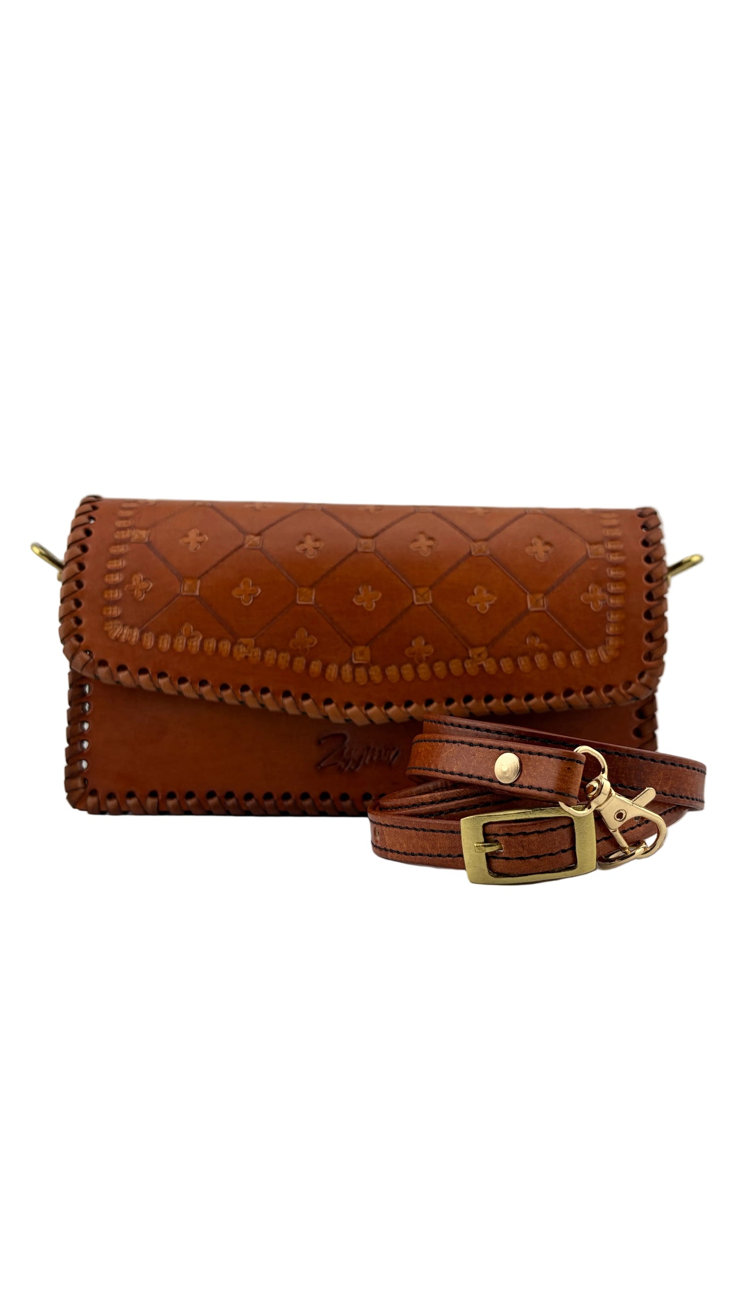 Brown leather bag with a strap on a light gray background