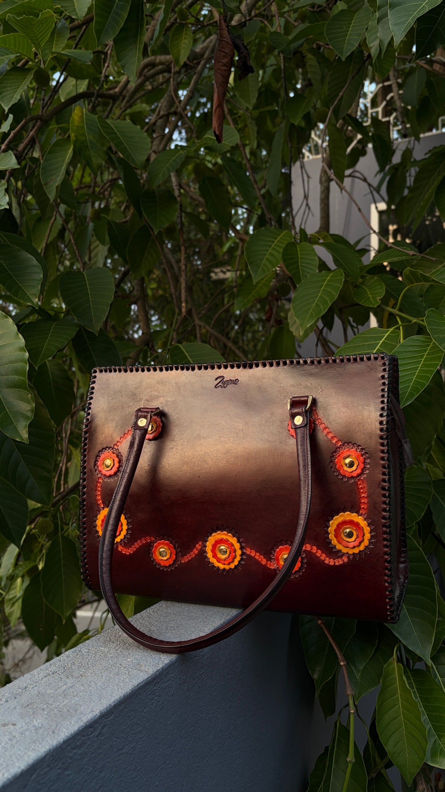 ZYGMA 14-Inch Handmade Genuine Leather Laptop Tote Bag | Deep Burgundy | 3D Hand-Applied Leather Flower Appliqué | Orange & Yellow Florals | Gold Stud Detail