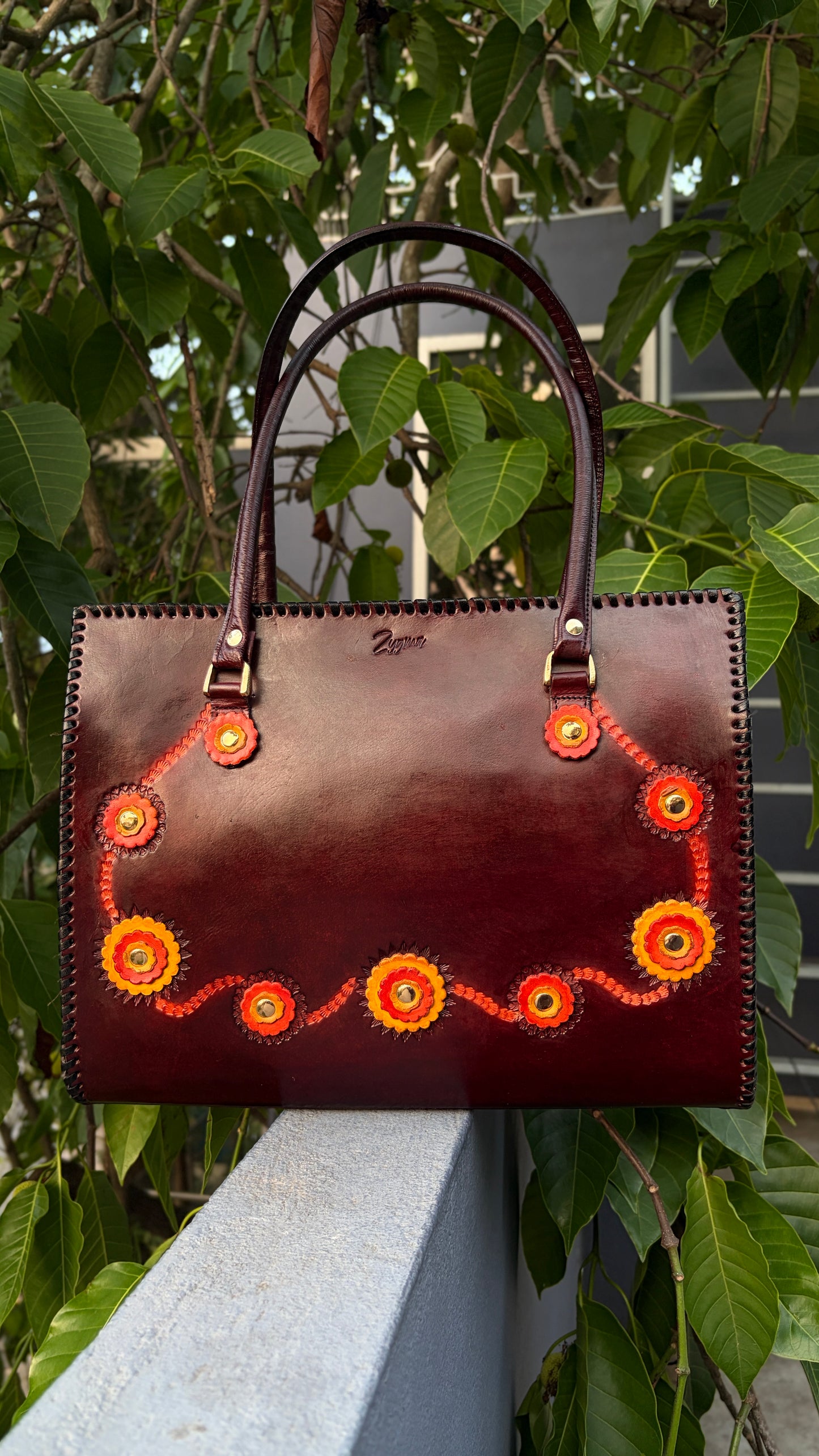 ZYGMA 14-Inch Handmade Genuine Leather Laptop Tote Bag | Deep Burgundy | 3D Hand-Applied Leather Flower Appliqué | Orange & Yellow Florals | Gold Stud Detail