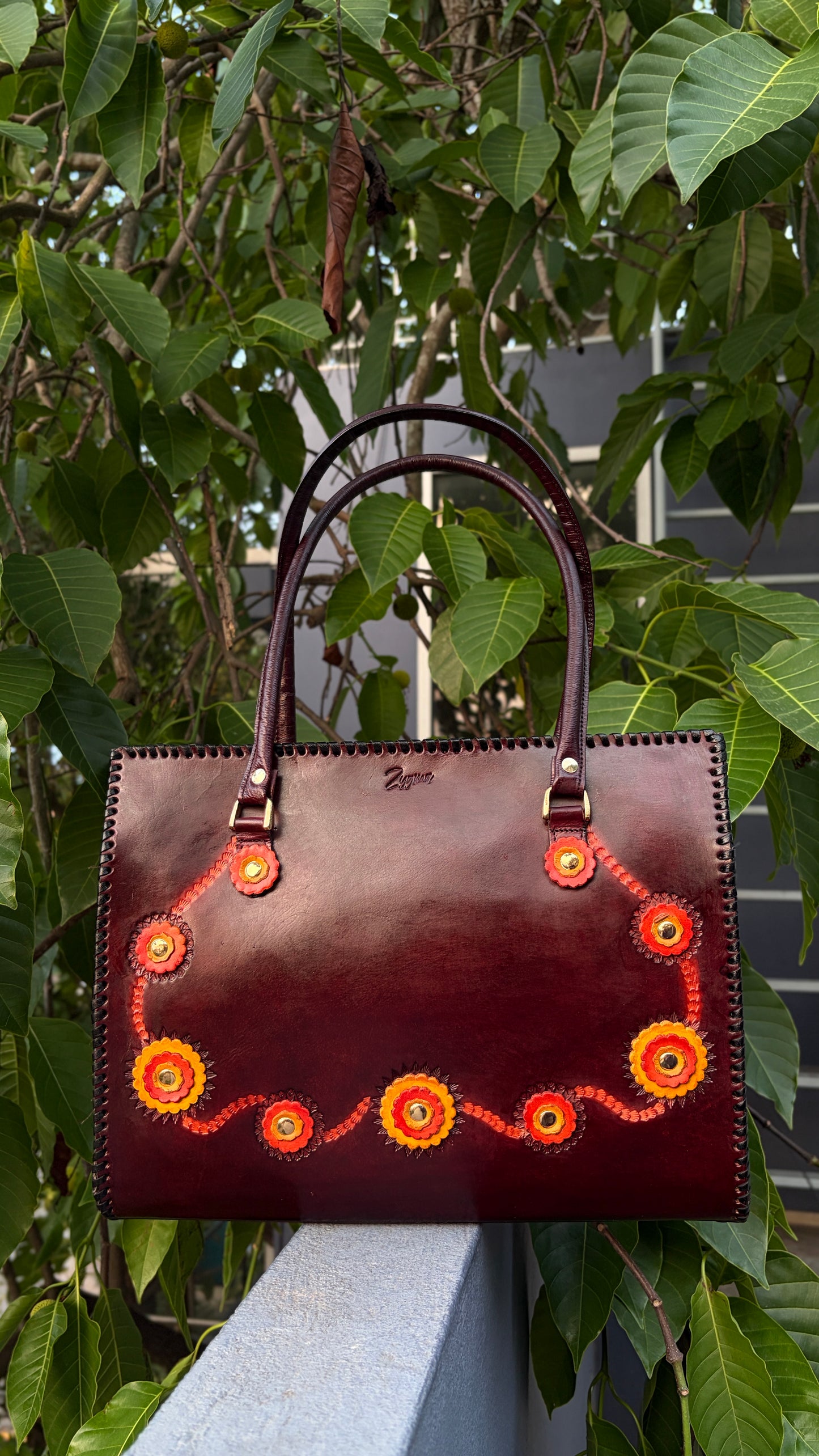 ZYGMA 14-Inch Handmade Genuine Leather Laptop Tote Bag | Deep Burgundy | 3D Hand-Applied Leather Flower Appliqué | Orange & Yellow Florals | Gold Stud Detail