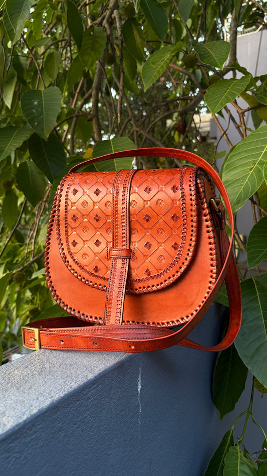 ZYGMA Handmade Genuine Leather Round Saddle Crossbody Bag | Cognac Tan | Diamond Clover Embossed Flap | Whipstitch Edge | Top Handle + Crossbody Strap
