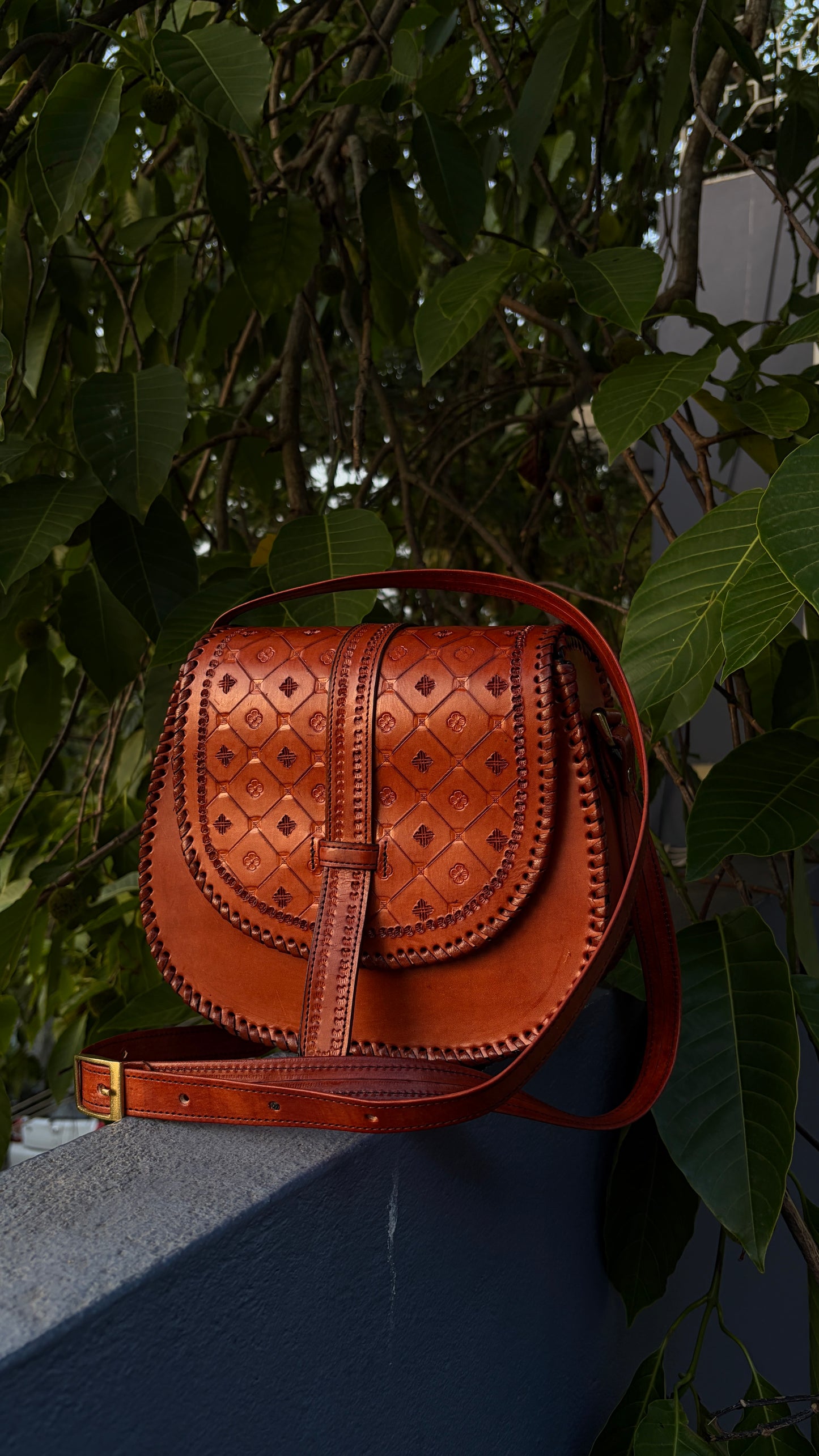 ZYGMA Handmade Genuine Leather Round Saddle Crossbody Bag | Cognac Tan | Diamond Clover Embossed Flap | Whipstitch Edge | Top Handle + Crossbody Strap