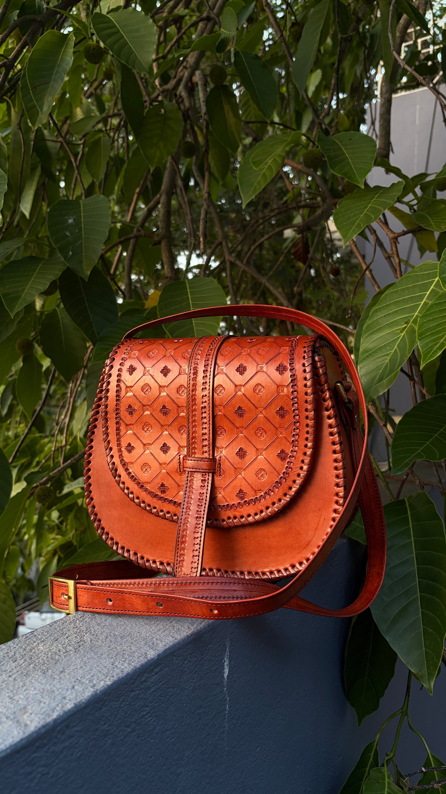 ZYGMA Handmade Genuine Leather Round Saddle Crossbody Bag | Cognac Tan | Diamond Clover Embossed Flap | Whipstitch Edge | Top Handle + Crossbody Strap