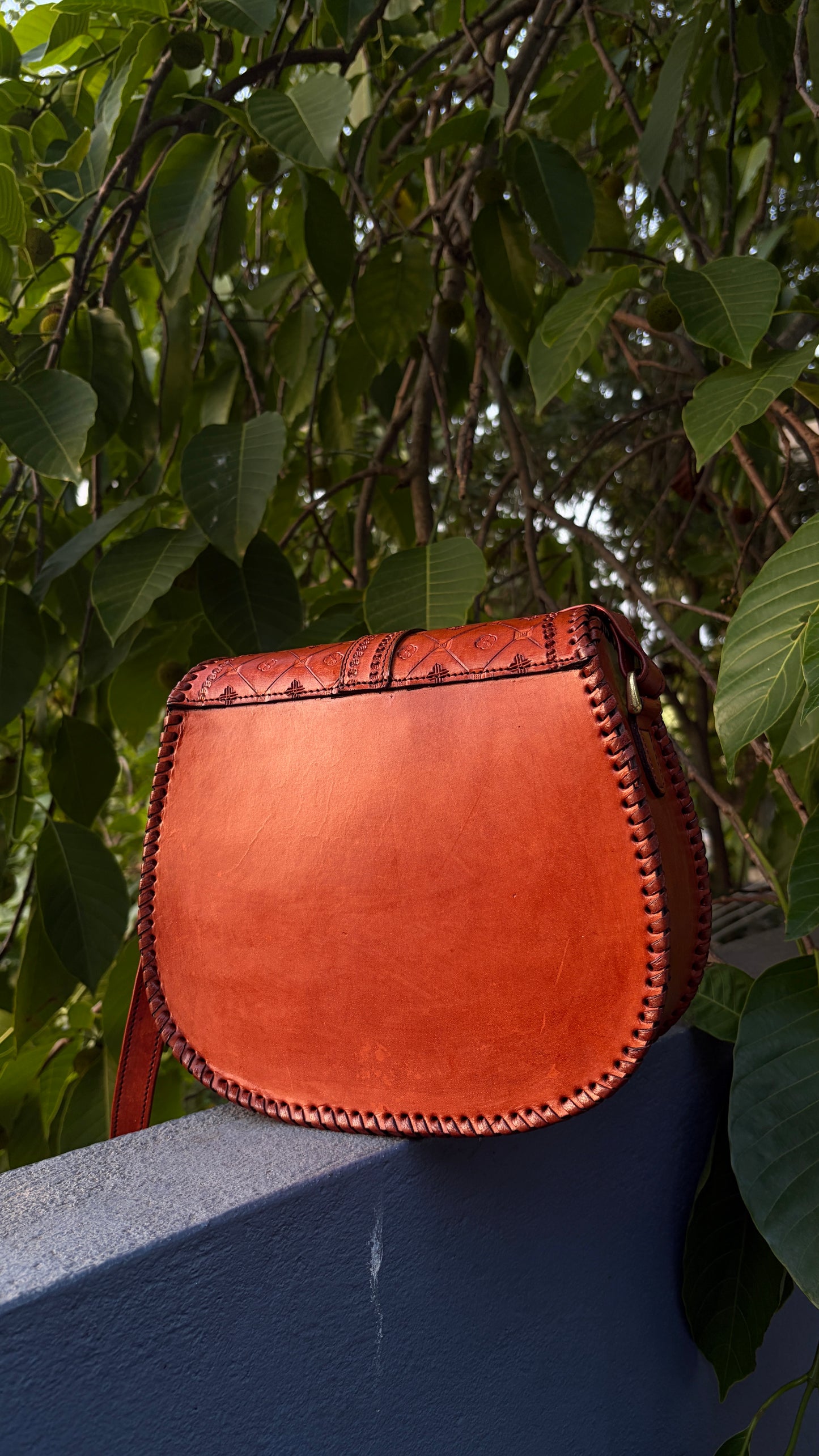 ZYGMA Handmade Genuine Leather Round Saddle Crossbody Bag | Cognac Tan | Diamond Clover Embossed Flap | Whipstitch Edge | Top Handle + Crossbody Strap