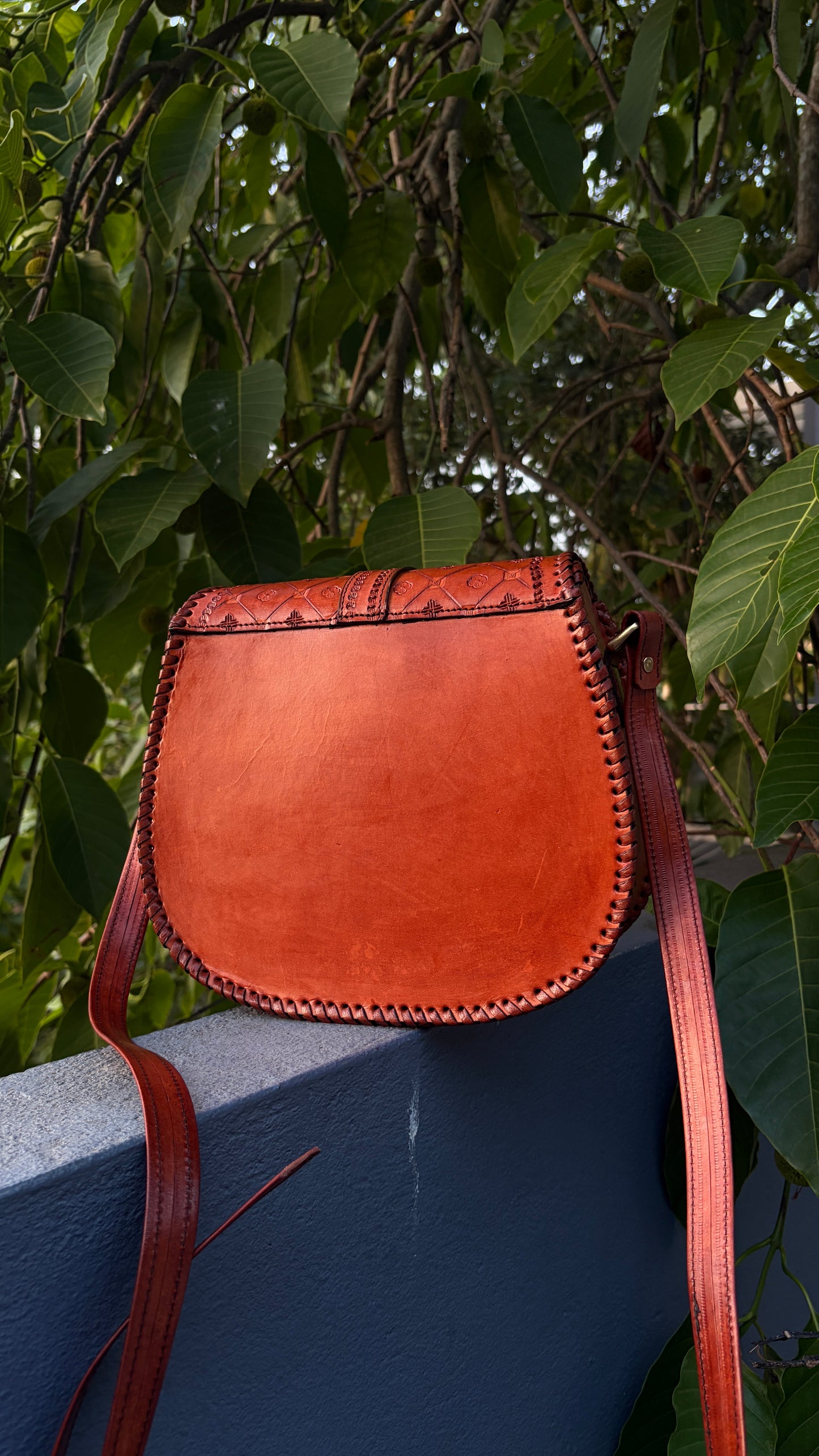ZYGMA Handmade Genuine Leather Round Saddle Crossbody Bag | Cognac Tan | Diamond Clover Embossed Flap | Whipstitch Edge | Top Handle + Crossbody Strap