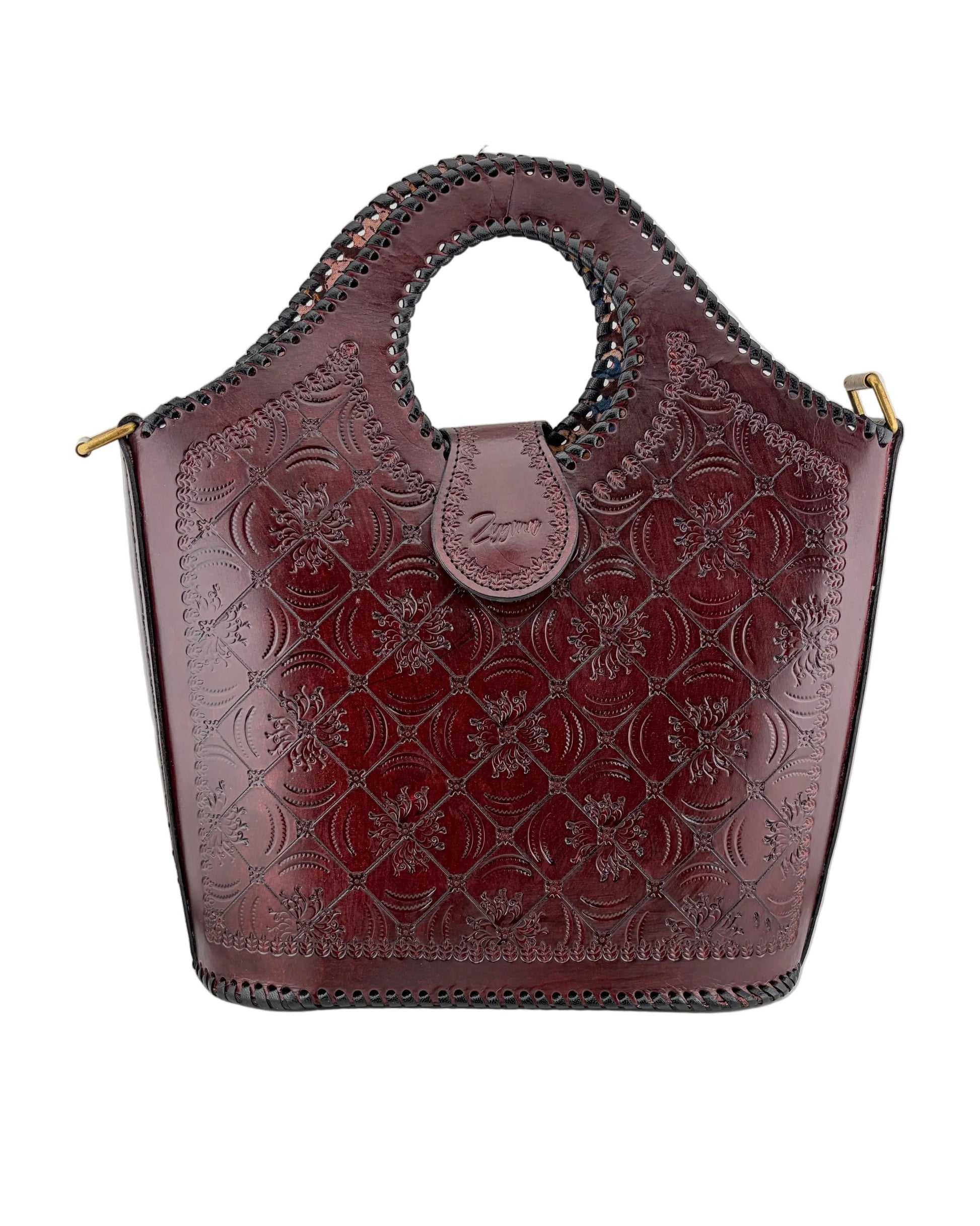 Brown leather handbag with floral embossing on a white background